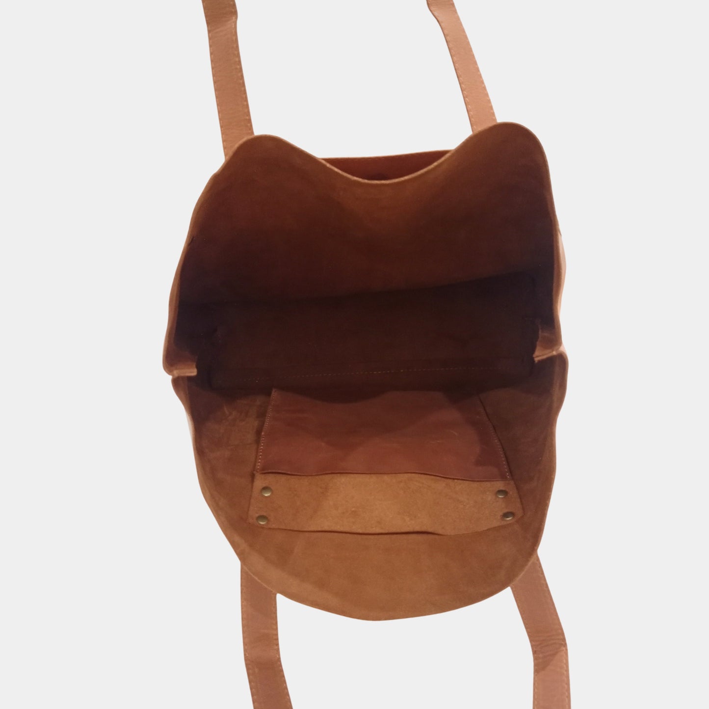 Empty Brown Chloe Leather Tote showing Unlined soft interior and inner Hanging organization Pocket