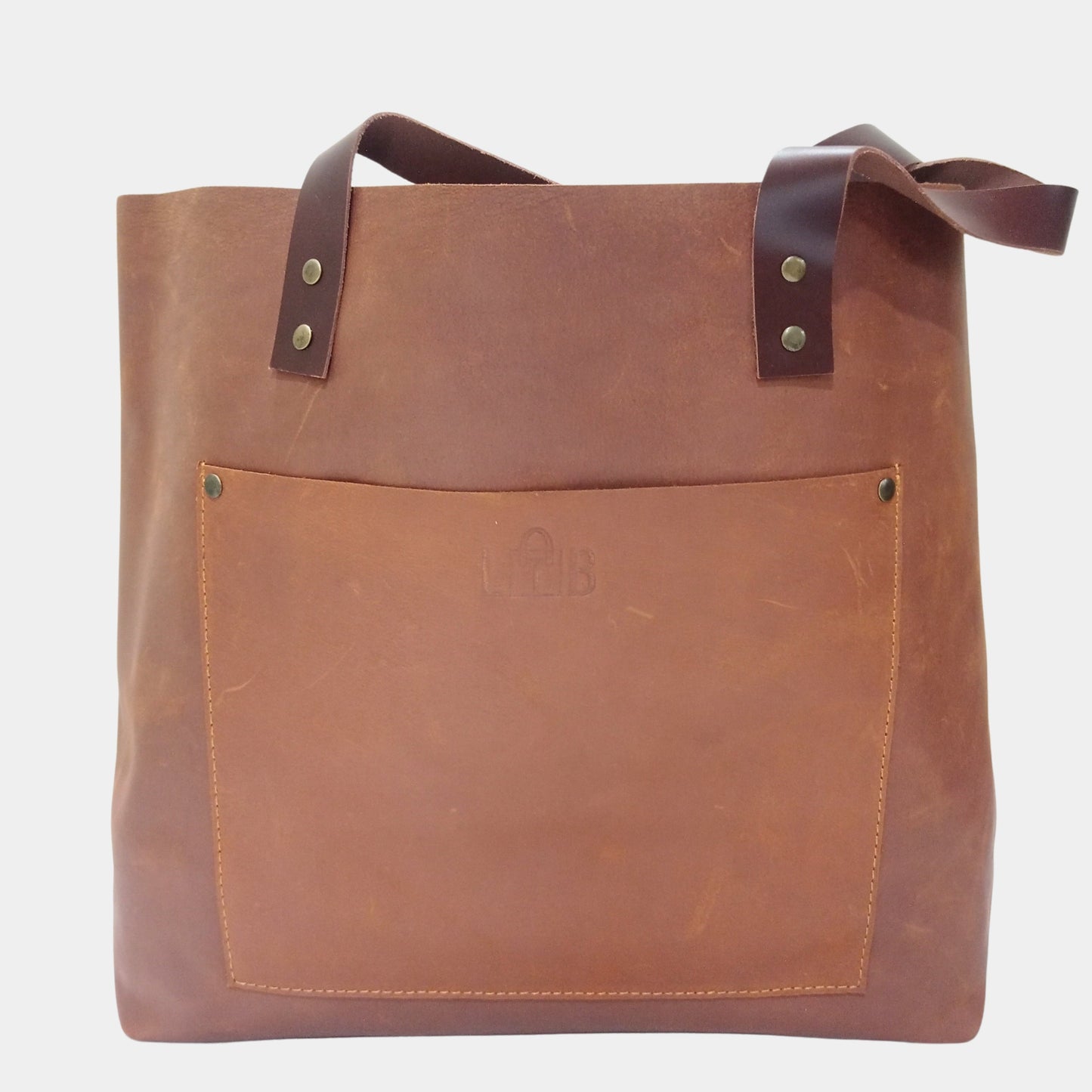 Stylish Willow Leather Tote crafted from premium crazy horse leather and handy front pocket