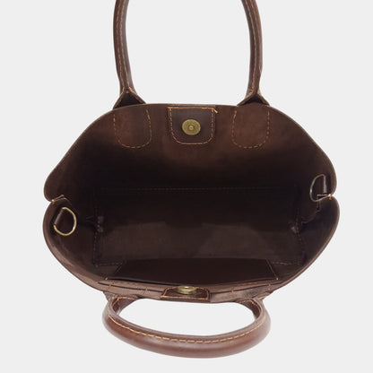 unlined soft interior of Sienna dark brown tote with magnetic snap button closure side sling pocket