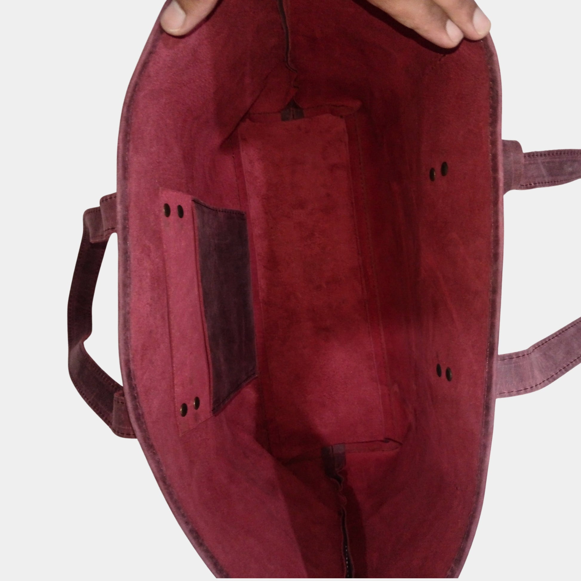 Empty Burgundy Work leather tote showing soft and sturdy unlined interior and organization hanging pocket