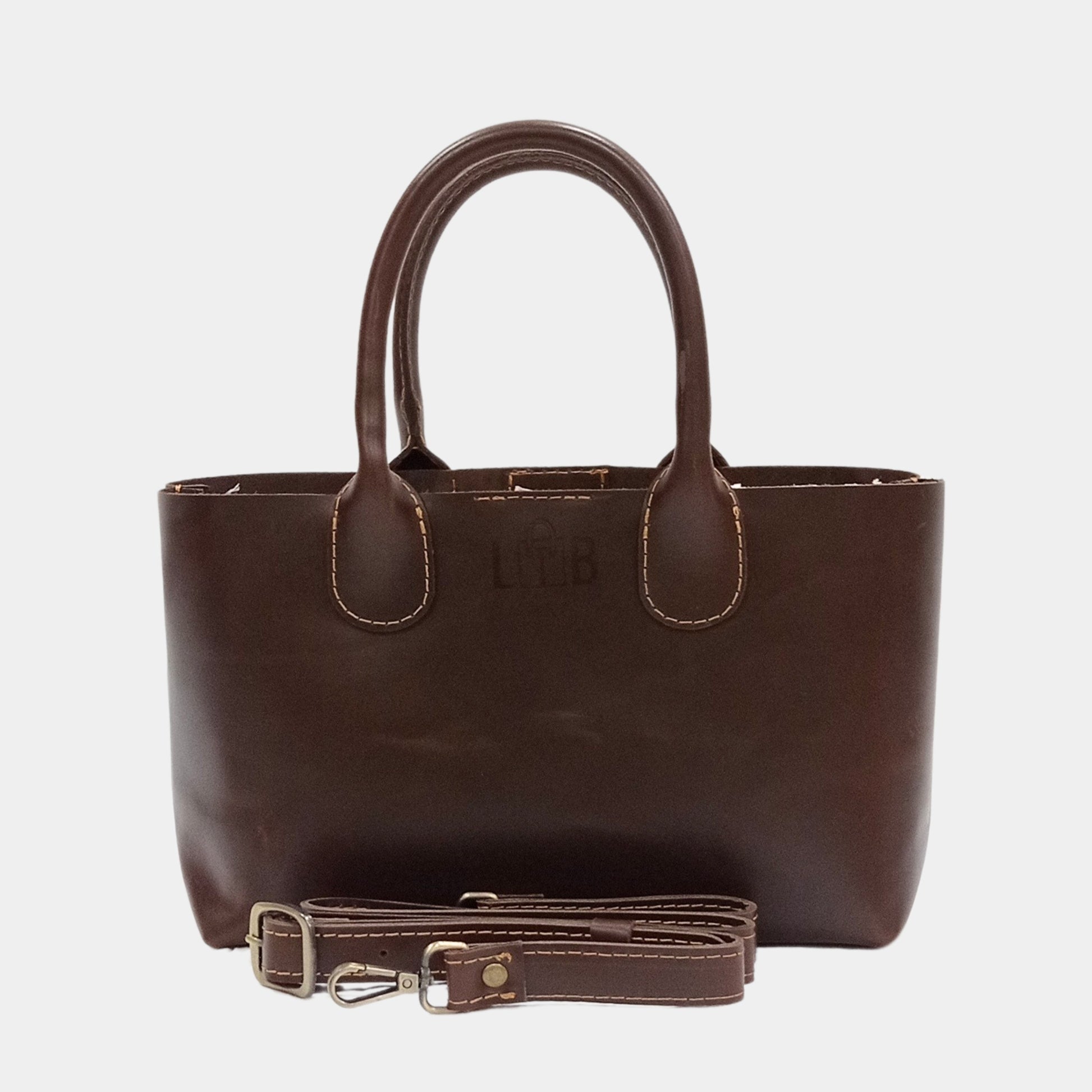 Sleek stylish Brown Leather Tote removable straps placed in front perfect for formal and casual occasions