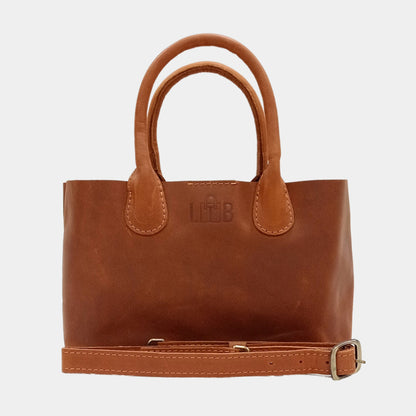 Sleek and stylish Mia leather small tote bag in timeless brown color with removable strap and brass hardware