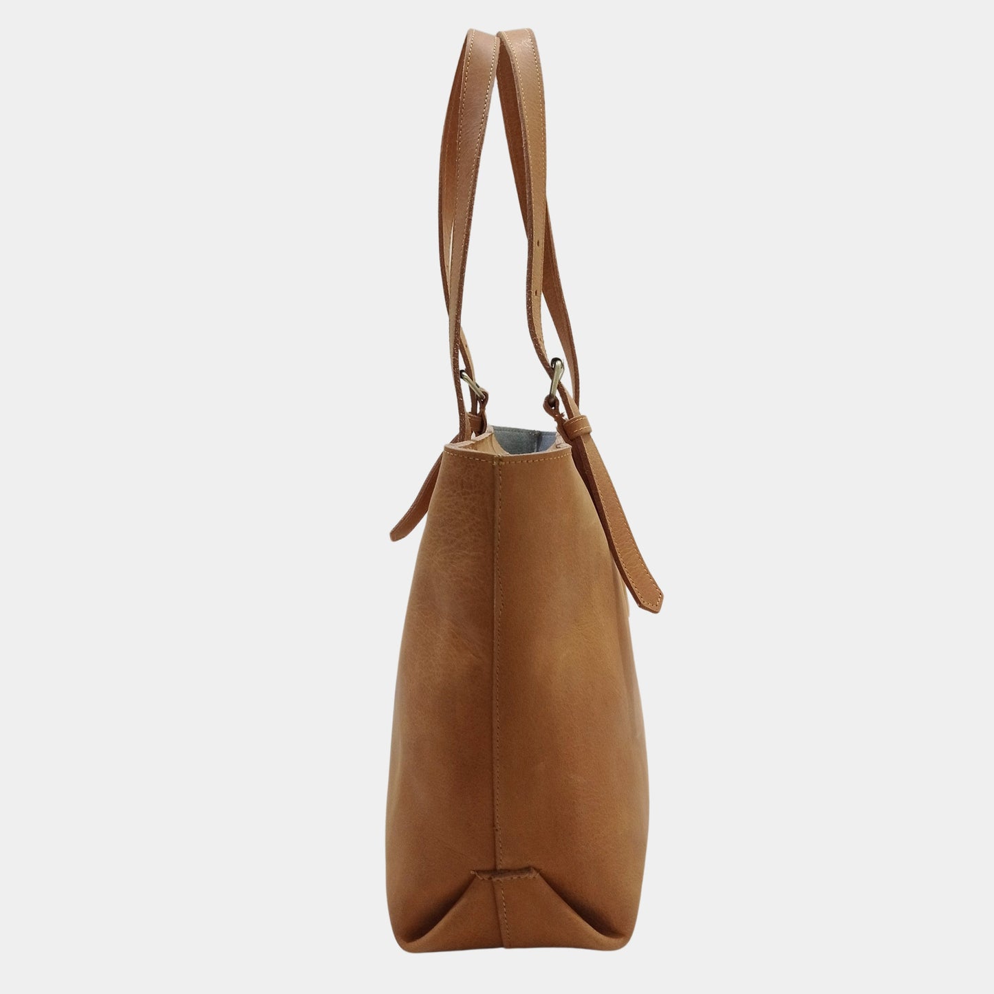 Side View of Brown Leather Tote with sleek leather straps