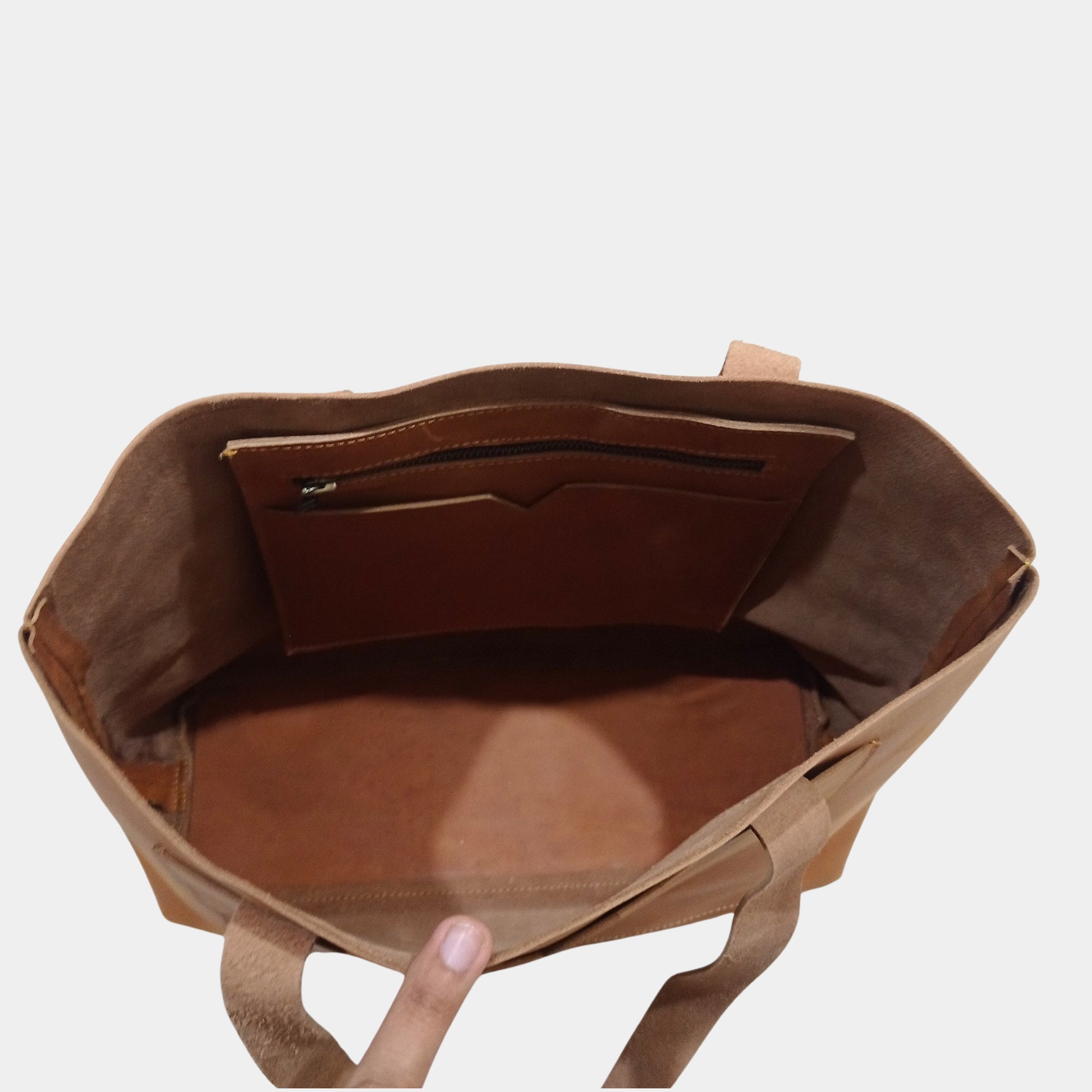 Top view of Matilda brown Leather Tote showing Hanging organization pockets and unlined tugged interior