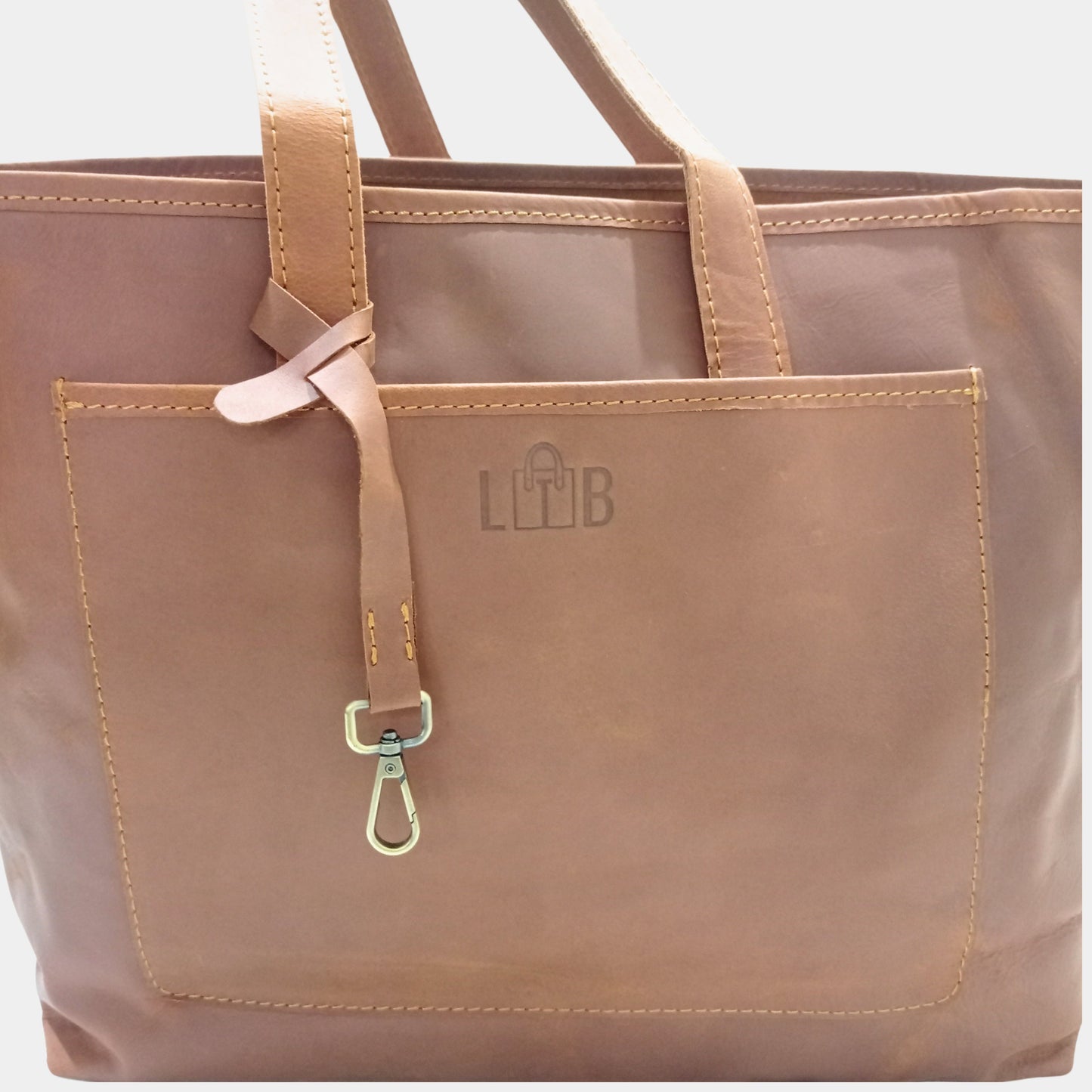 Classic stylish Brown Leather Tote Bag showing LTB logo and brass accessory strap