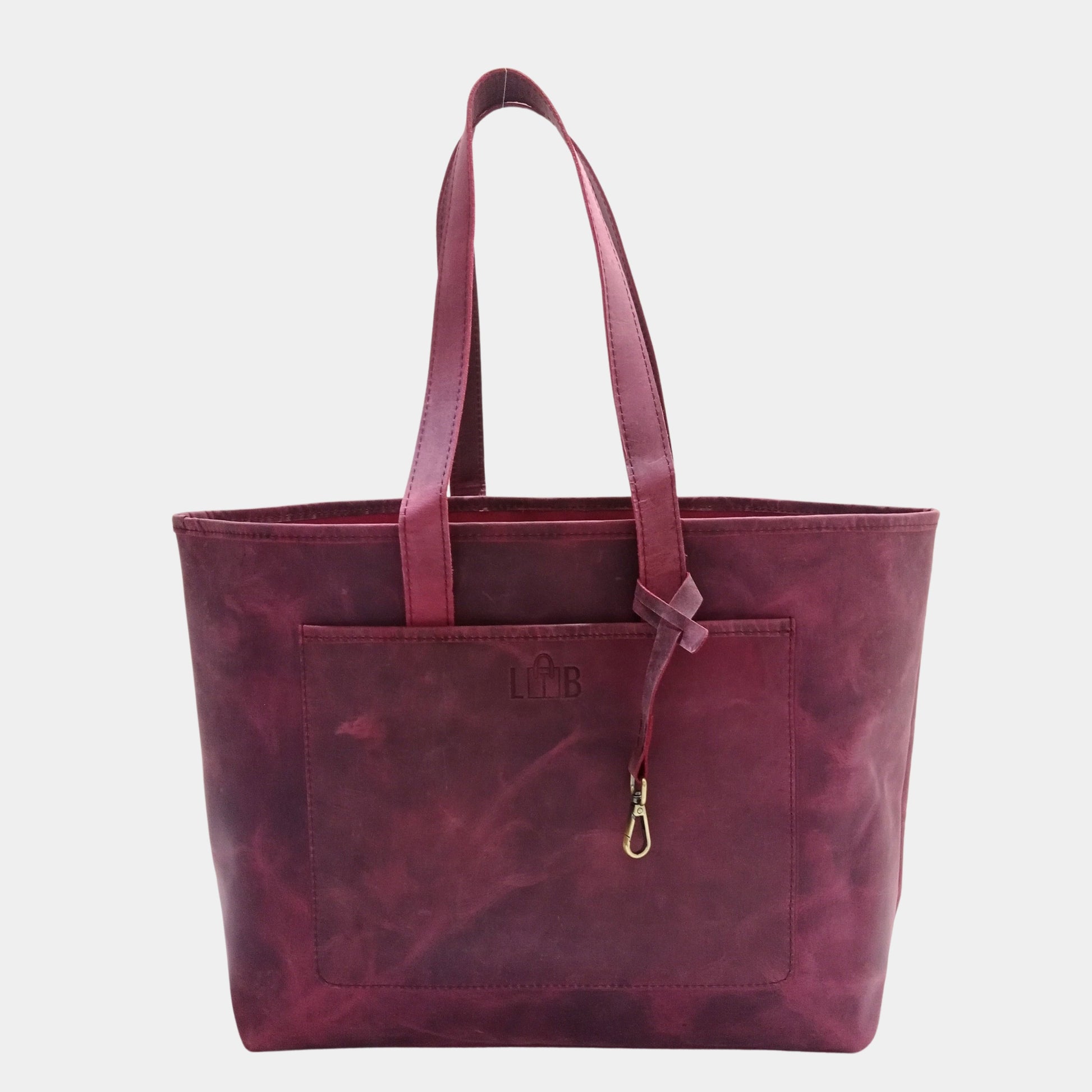 Stylish Deep Burgundy Work Leather Tote Bag with front pocket and elegant brass accessory strap