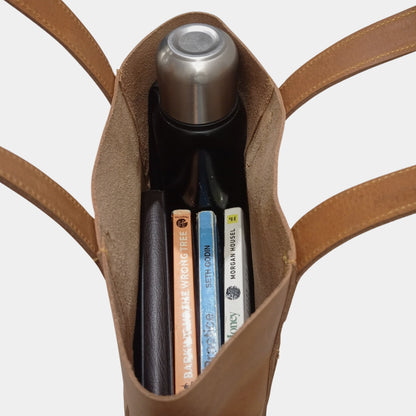 Inside view of stylish Sophia Leather Tote having a water bottle and books